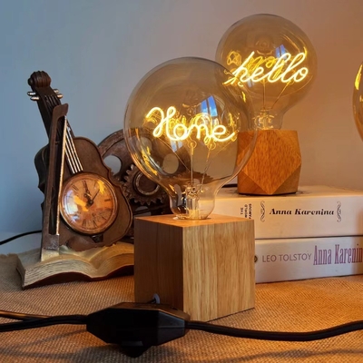 Base de bombilla de filamento LED 4W Vidrio Ambar claro Serie G80/95 Dispersible Hola Carta de amor